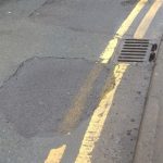 Water leak and pot hole on Emmbrook Road